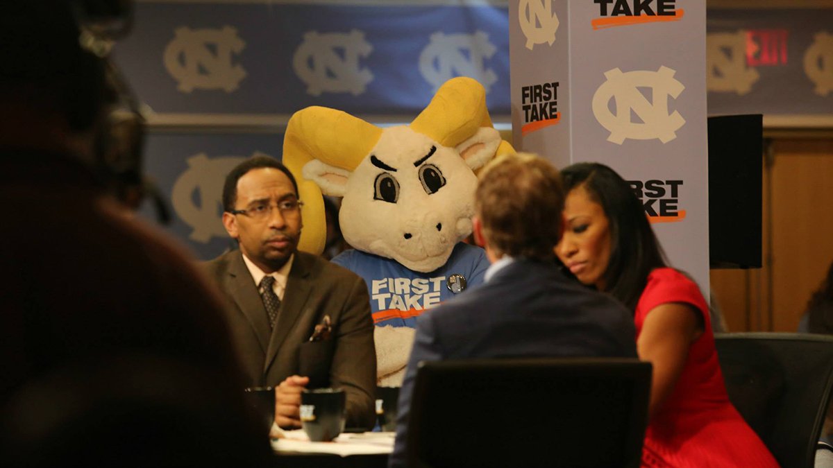 Rameses stands behind the set of First Take.