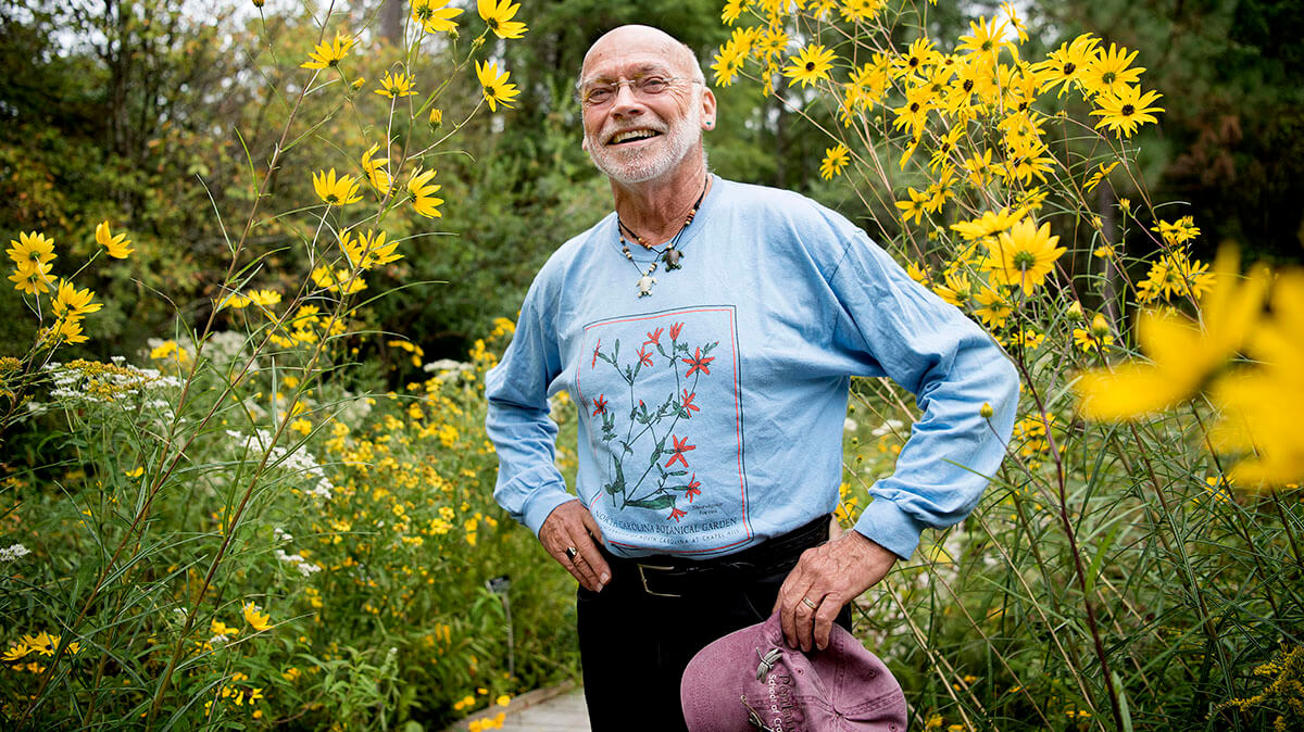 Ken Moore stands in the Botanical Gardens.