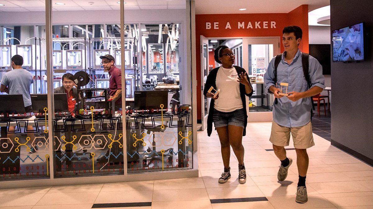 Students walk in the Makerspace.