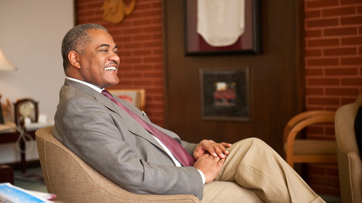 Elson S. Floyd sitting in a chair.