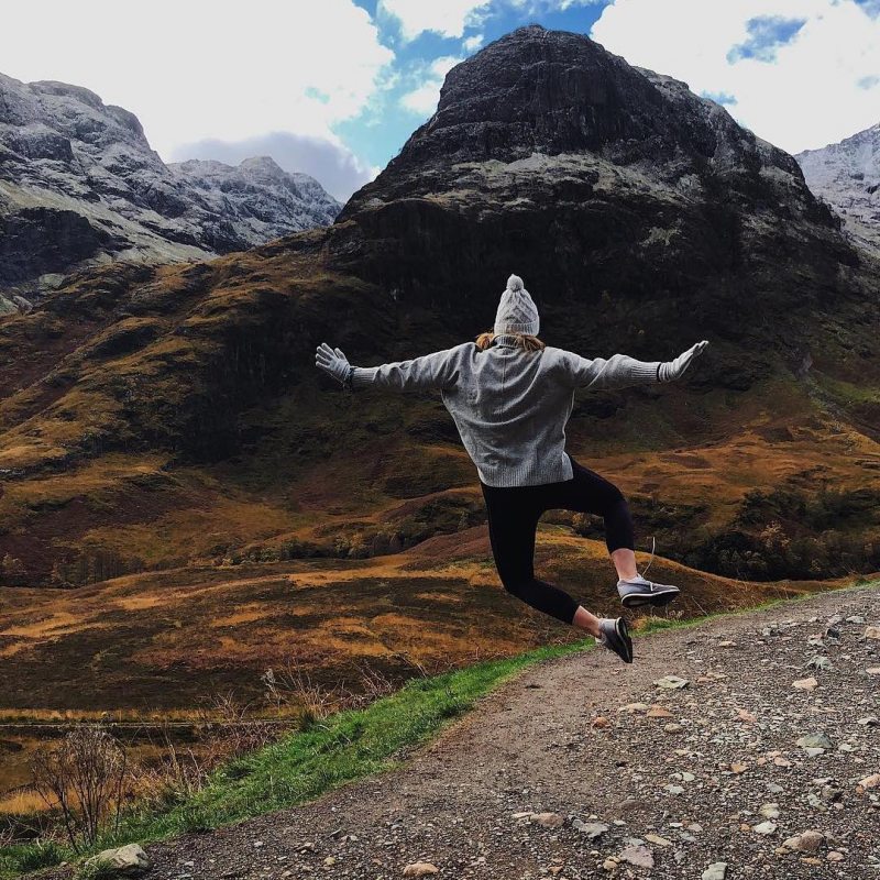 Student clicks her heels in the mountains of South America