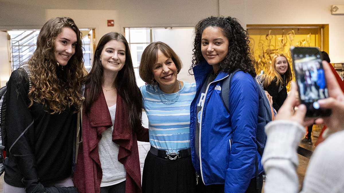 Chancellor Carol L. Folt posed for a photo with three students.