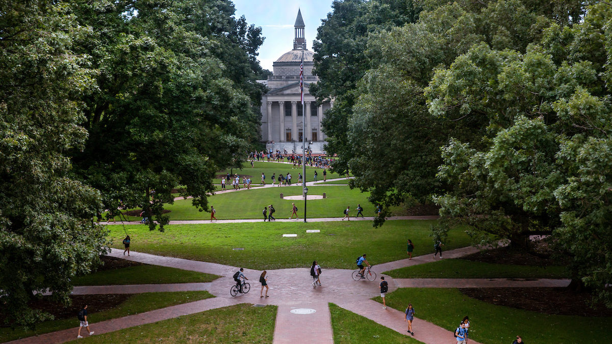 Aerial shot of students crossing Polk Place quad