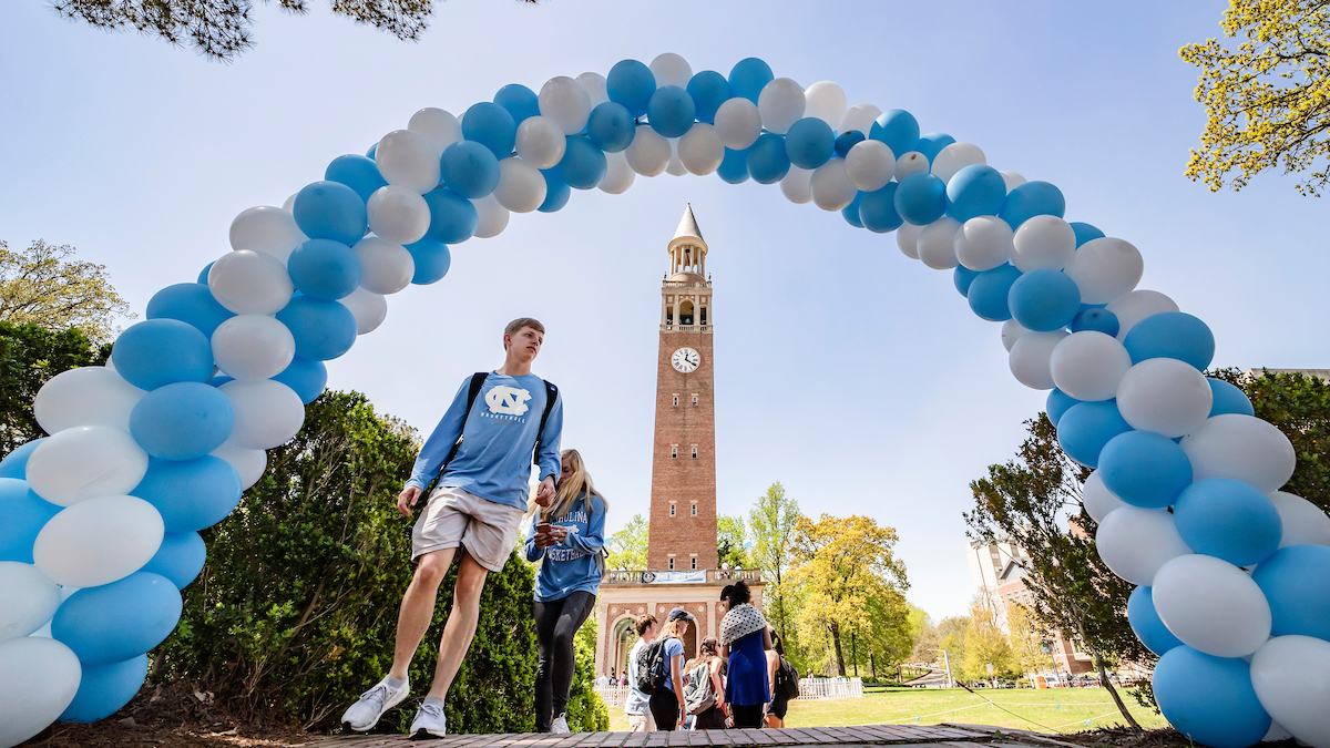 A student walks under balloons at the annual Senior Bell Tower Climb.