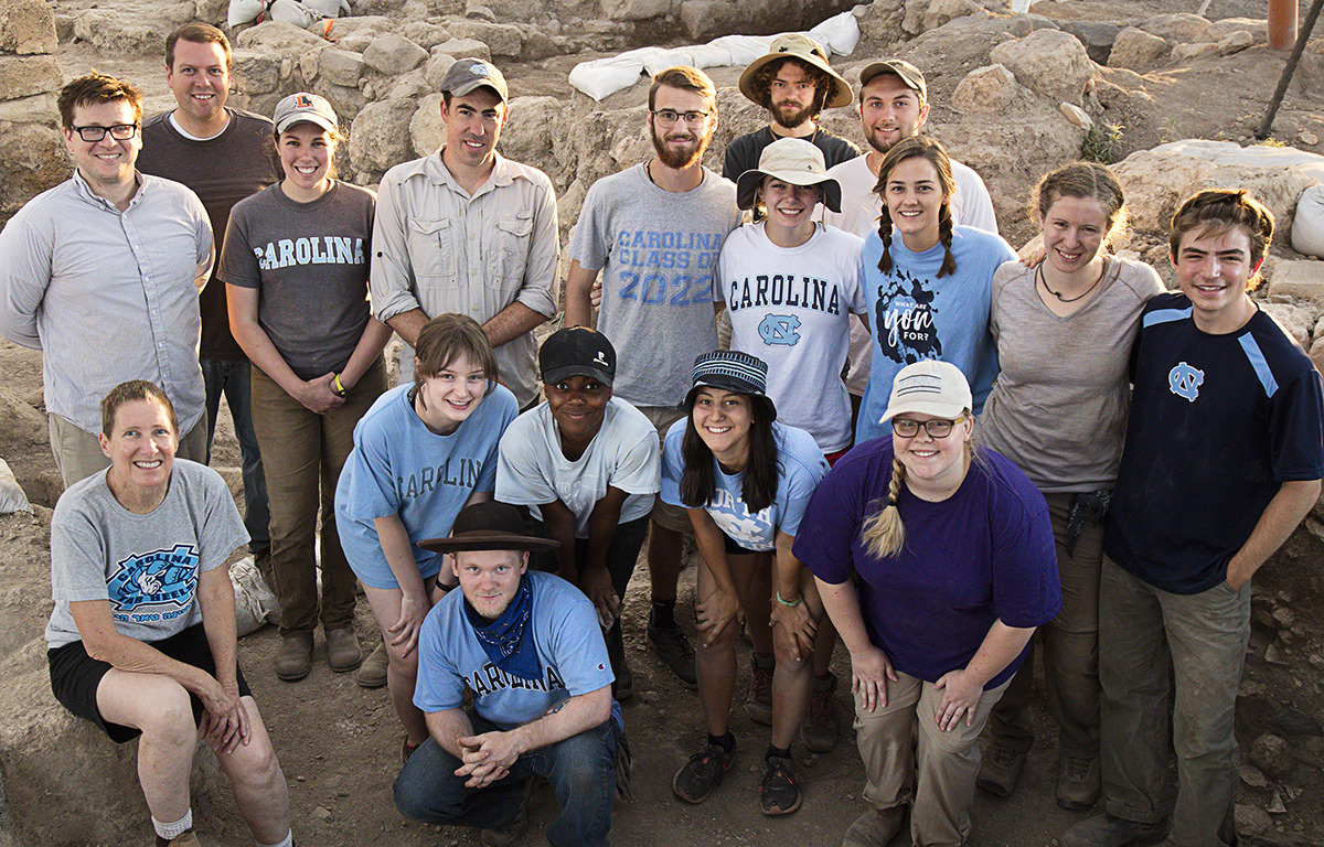 Students pose for a photo at the dig site.