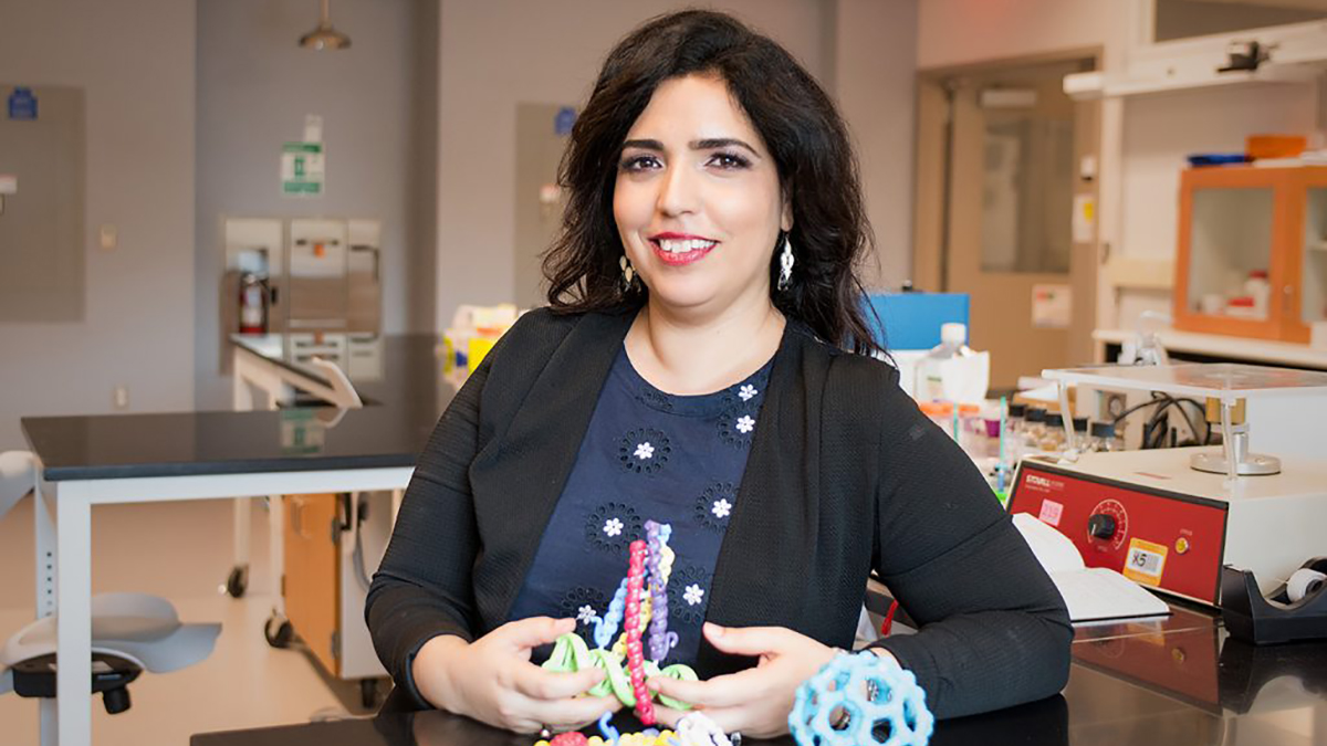 Ronit in the lab holding model DNA