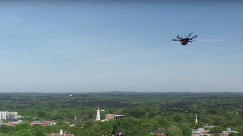 A drone flys over campus.