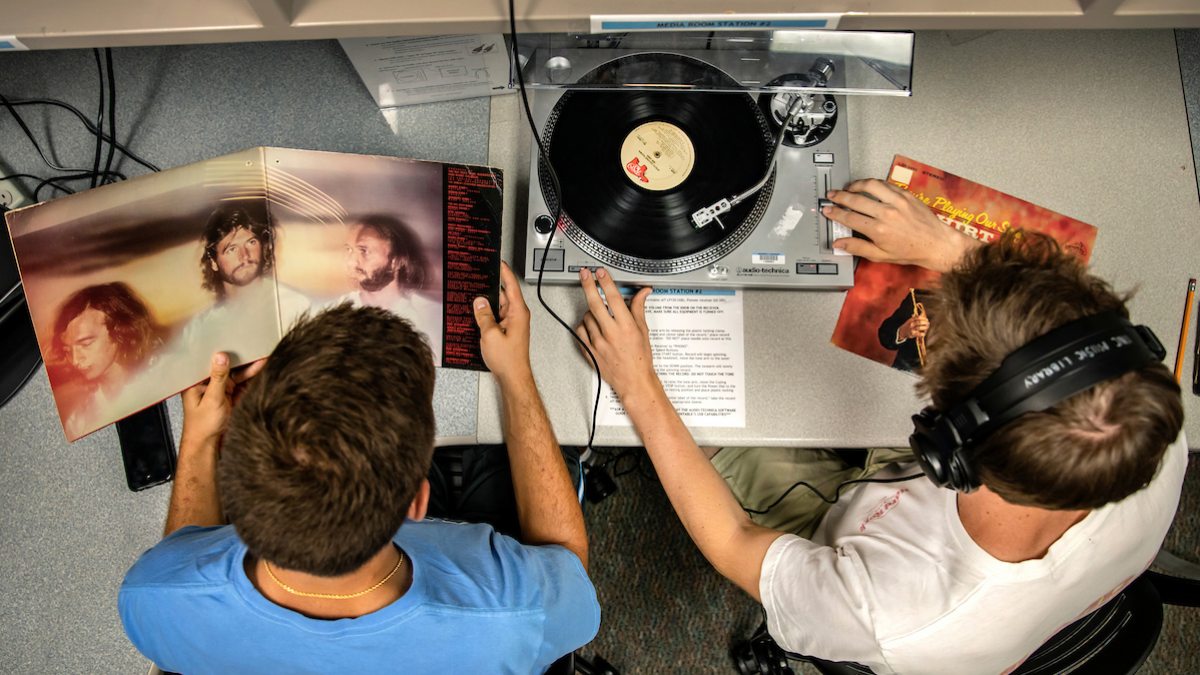 students listen to a record player.