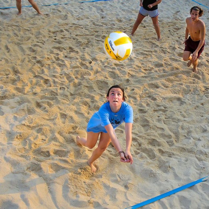 A woman playing volleyball
