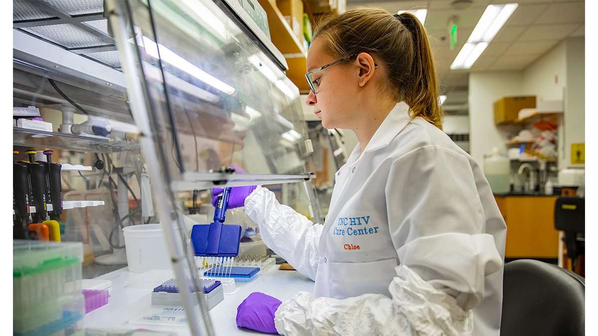 Researcher works with pipettes at the lab bench