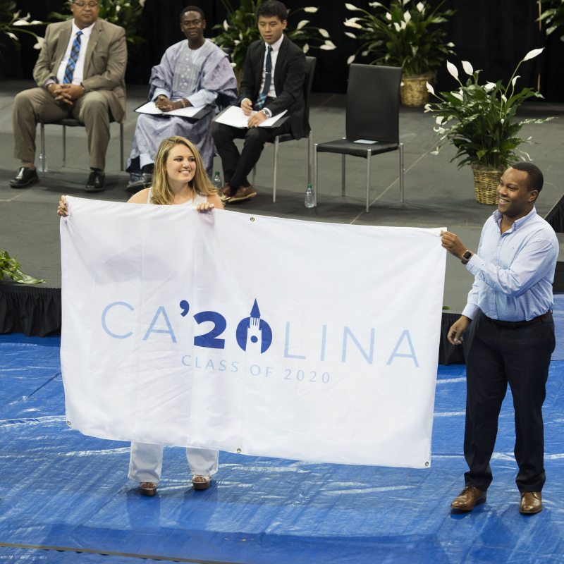 Students hold a flag that says Carolina '20