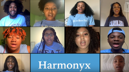 A screenshot of a zoom call where students sing together.
