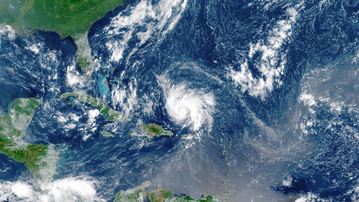 A satellite view of a hurricane forming in the Atlantic Ocean.