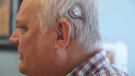A man wearing a cochlear implant.