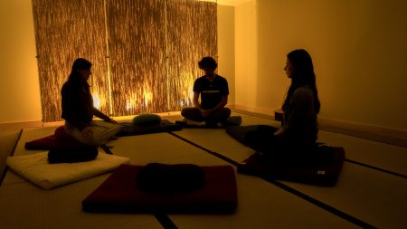 Students sitting in a meditation room.