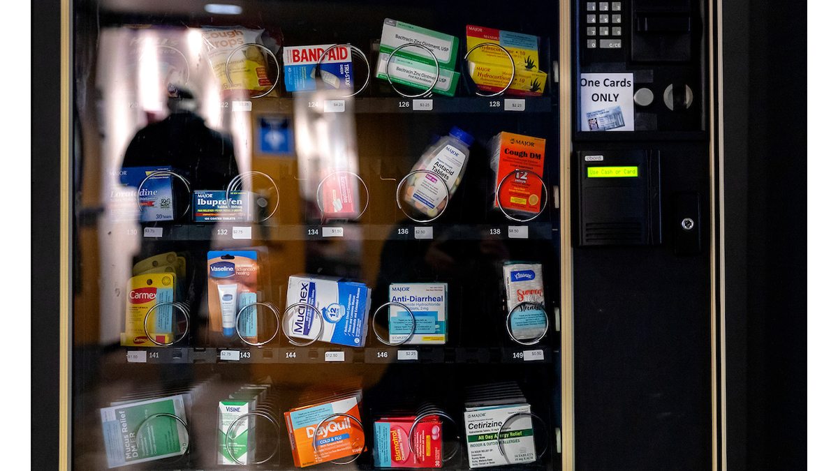 A vending machine with health care products in it.