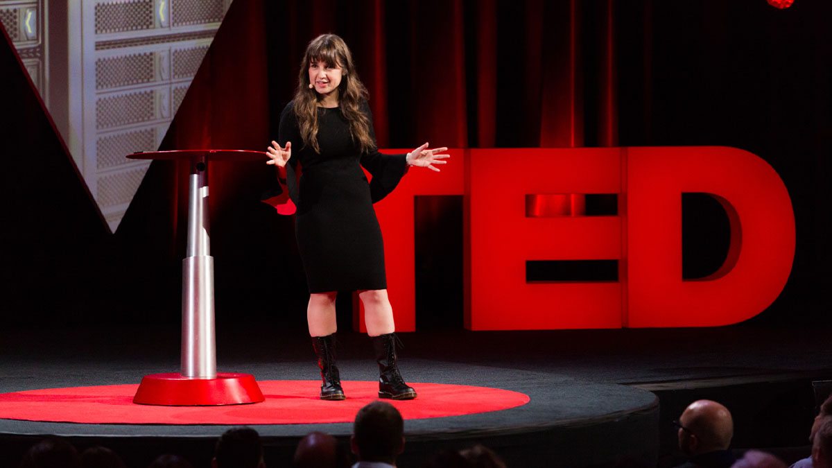 Zeynep Tufekci talking on stage during a TED talk.