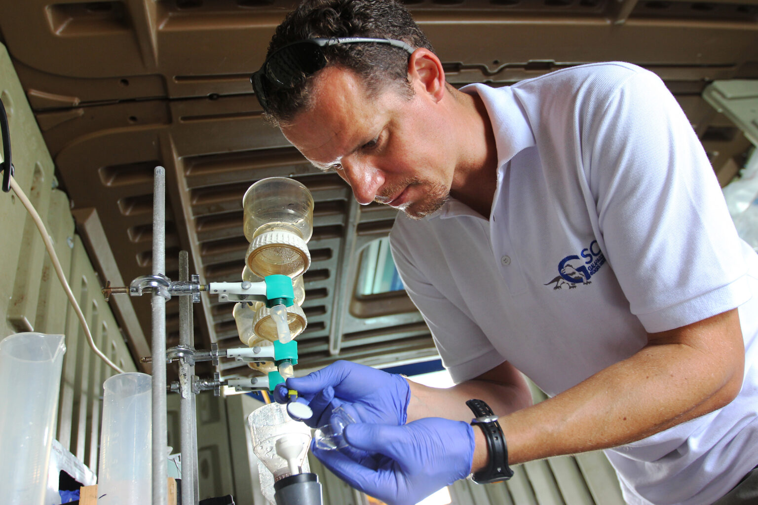 Adrian Marchetti filters water samples.