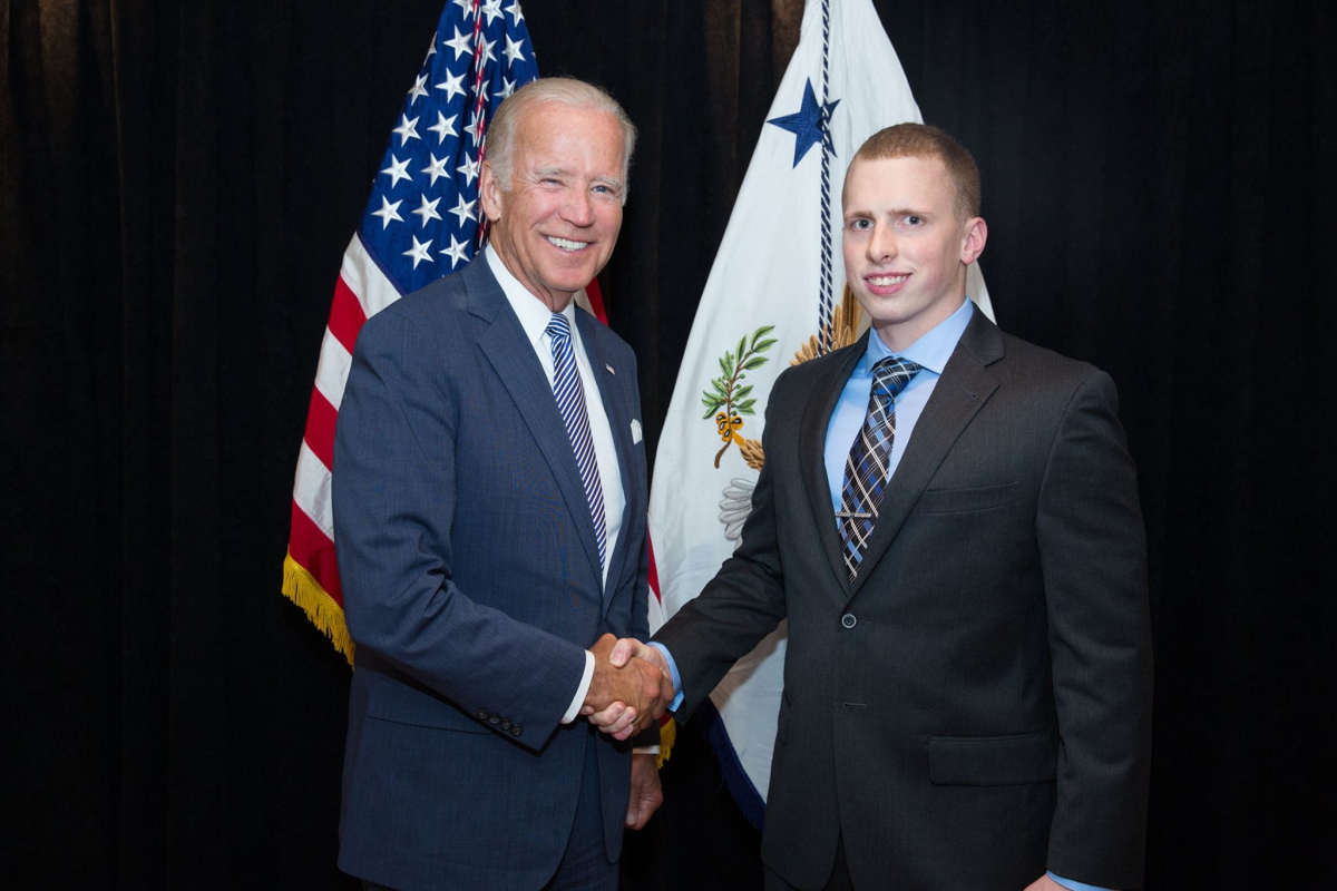 Joe Biden shakes hands with Tim Sloan. 