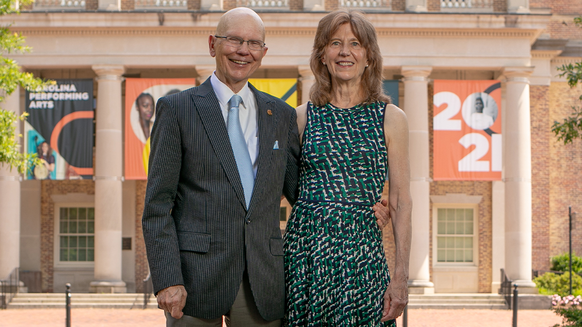 James and Susan Moeser standing outside Memorial Hall.