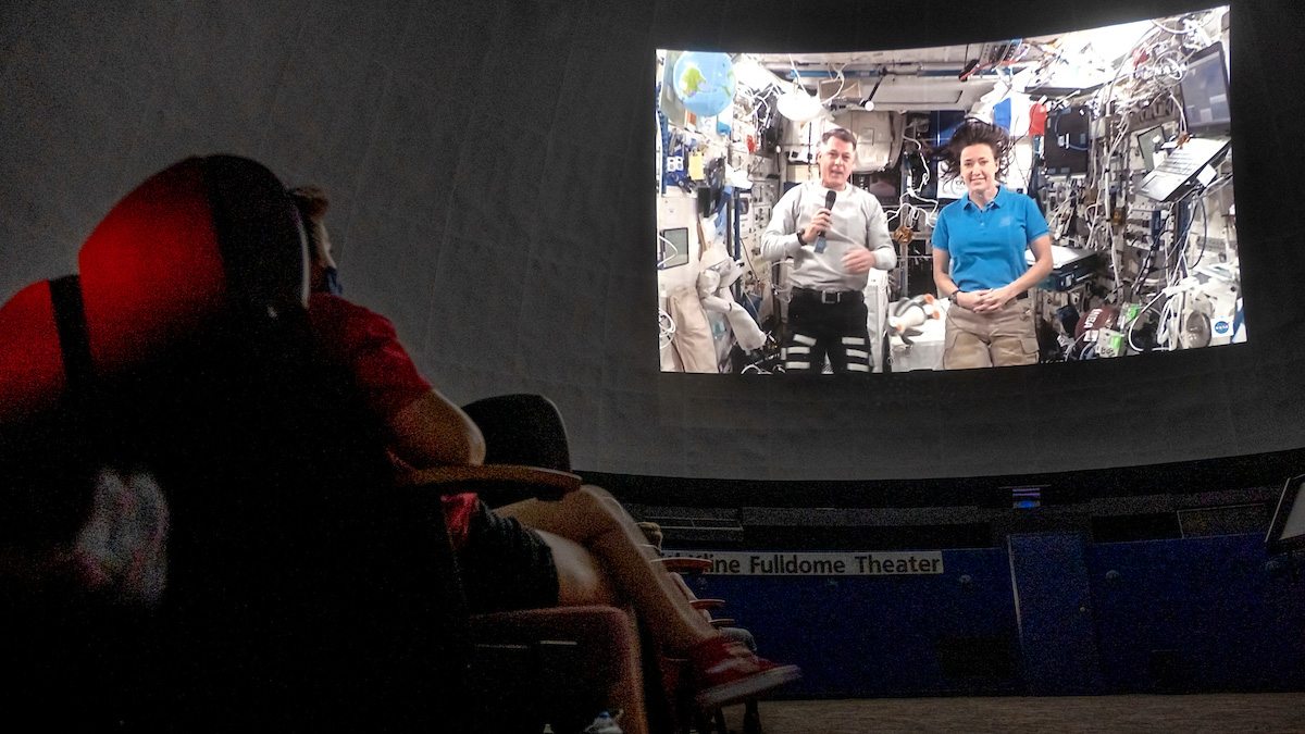 A video of Megan McArthur and Shane Kimbrough in the International Space Station being projected onto the planetarium dome.