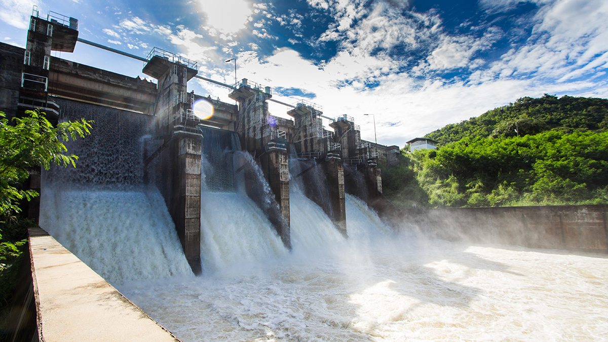 Water flows over a dam.
