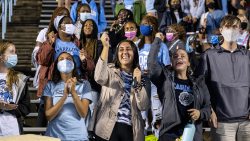 Student cheer in the stands of Kenan Stadium.