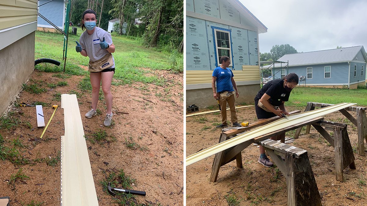 Students working on construction at a habitat for humanity build.