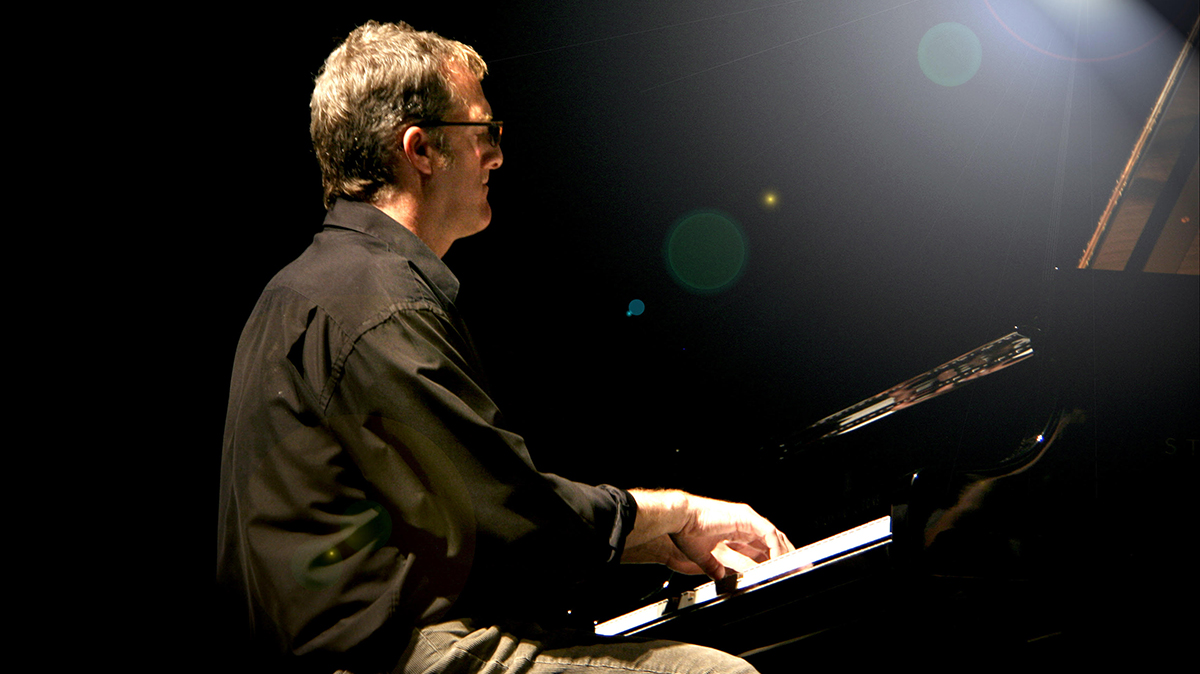 Stephen Anderson playing the piano.