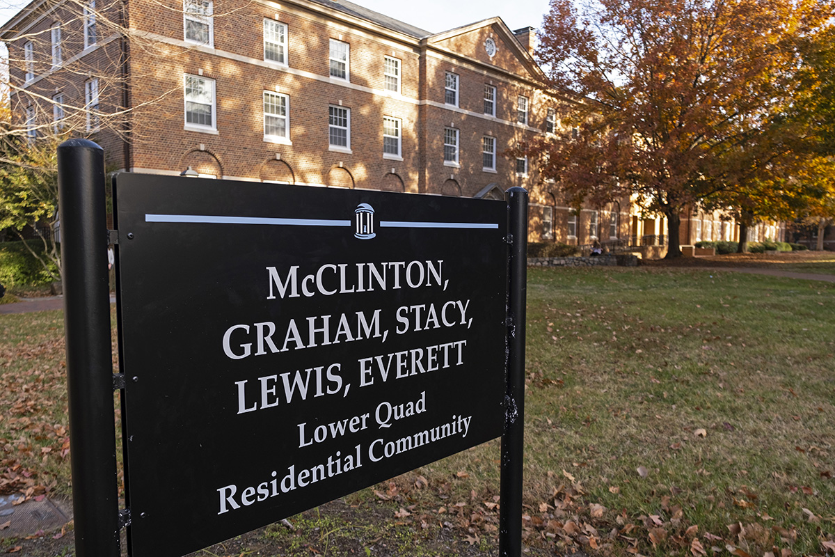 A black sign outside a dorm building with McClinton's name on it.