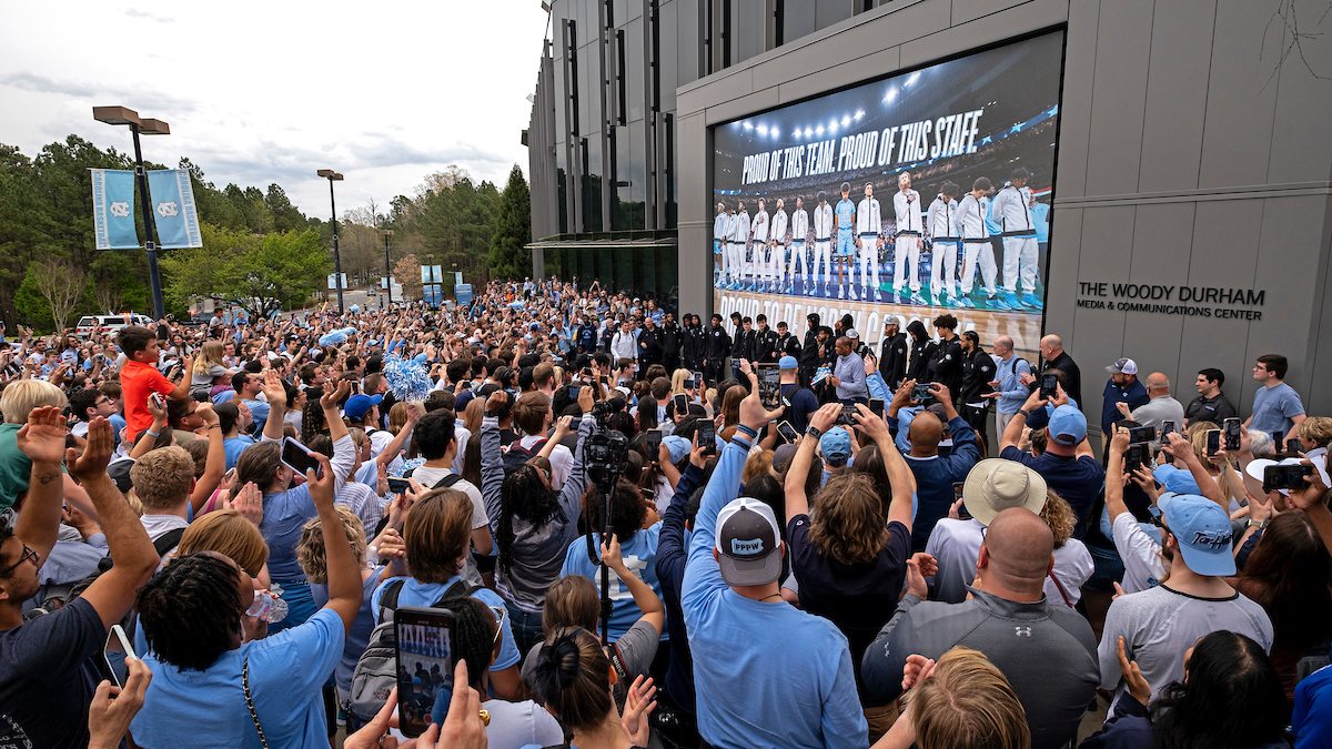 People standing around the Dean Dome.