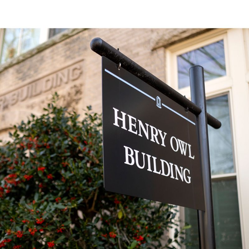 A sign for the Henry Owl Building.