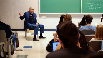 Lewis Black speaking to a class of students on campus.