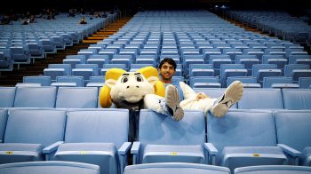 Daniel Wood in the Rameses outfit sitting in the stands.