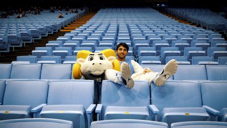 Daniel Wood in the Rameses outfit sitting in the stands.