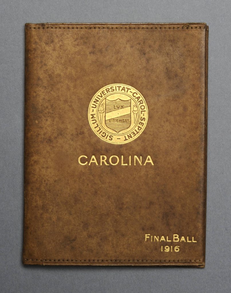 A leather card holder with "Carolina" printed in gold across the front