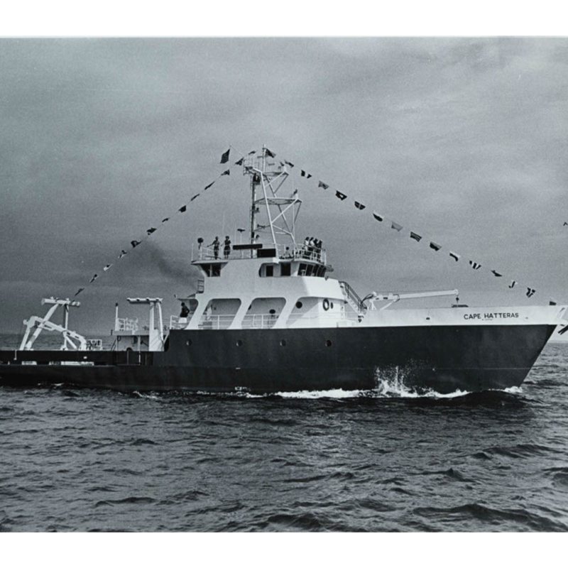 A ship with a banner in a black and white photo