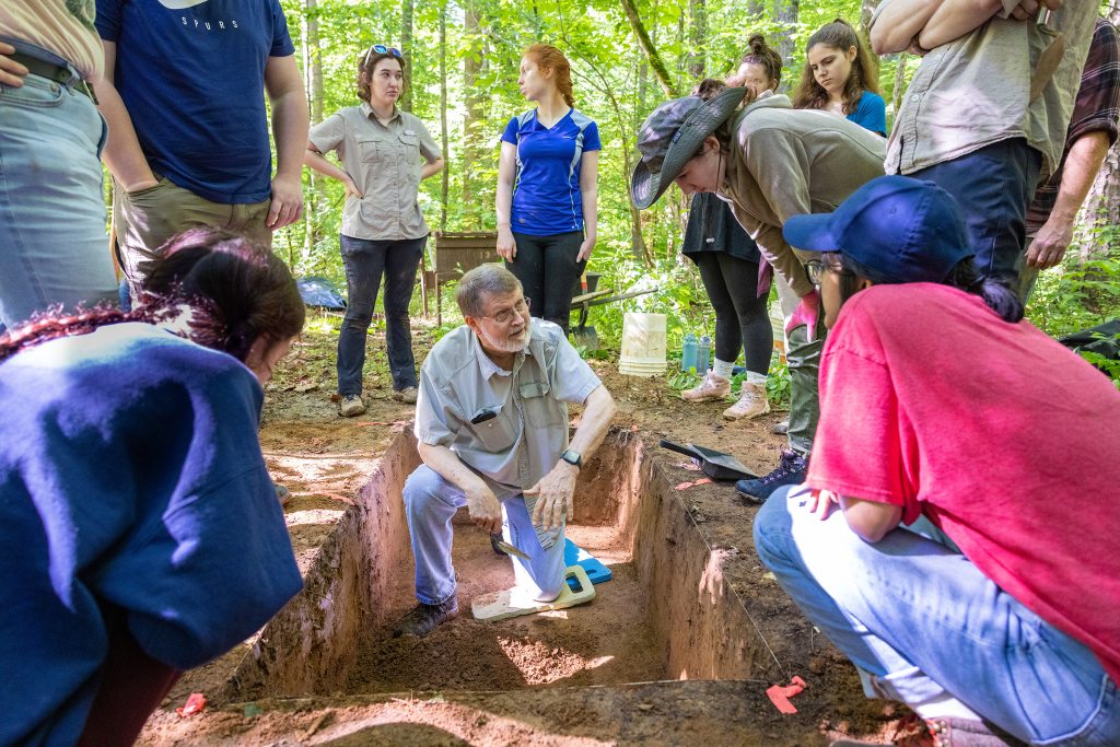 Dr. Steve Davis teaches students participating in UNC’s Archaeological field school