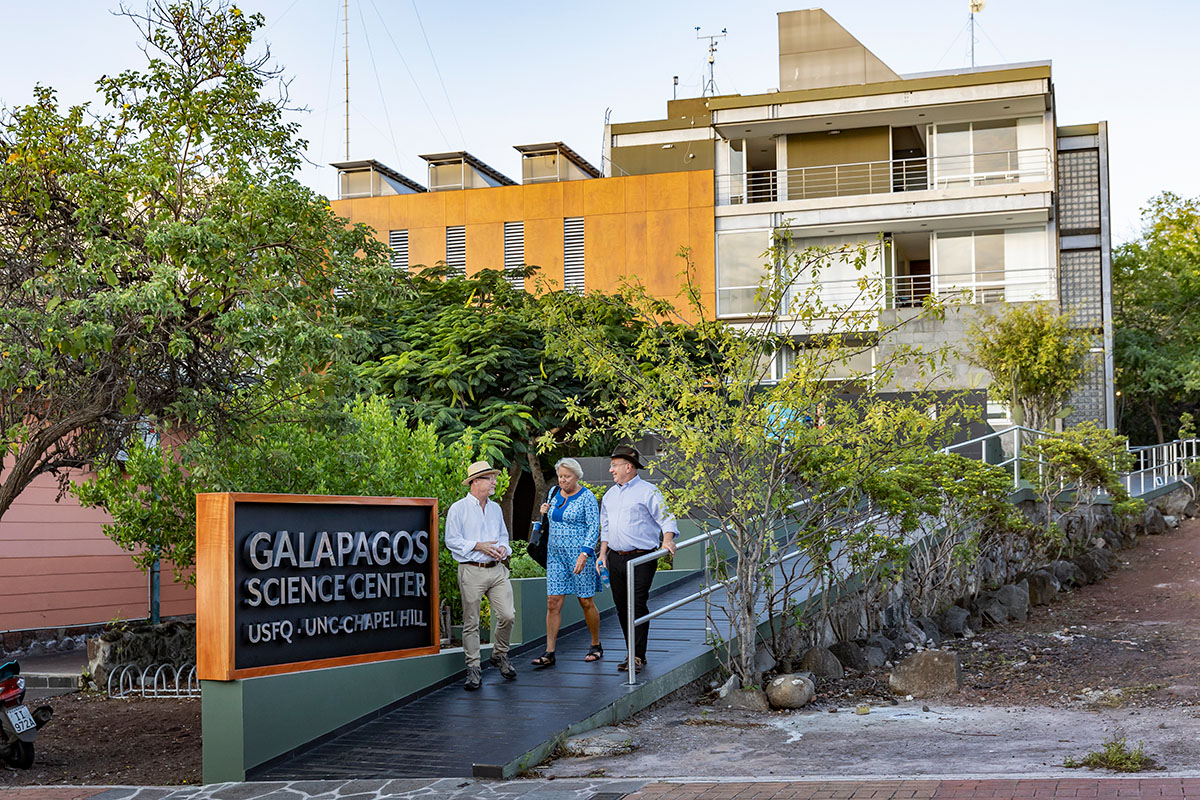 People walking outside the Galapagos Science Center.