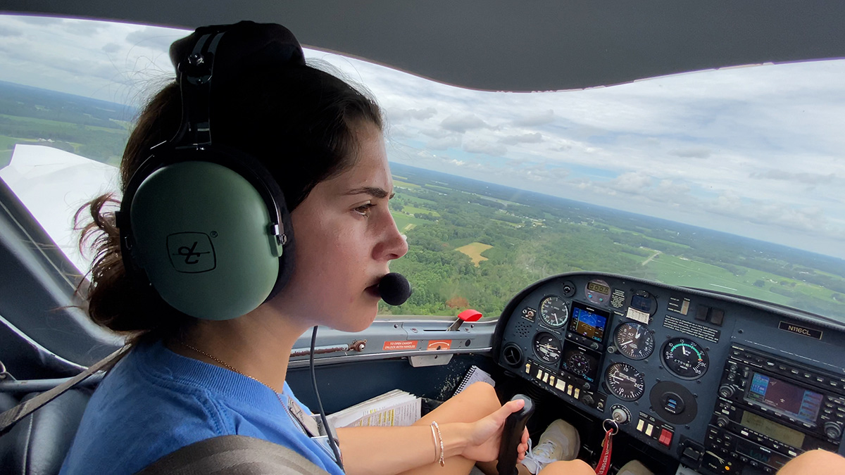 Paige Court flying a plane.