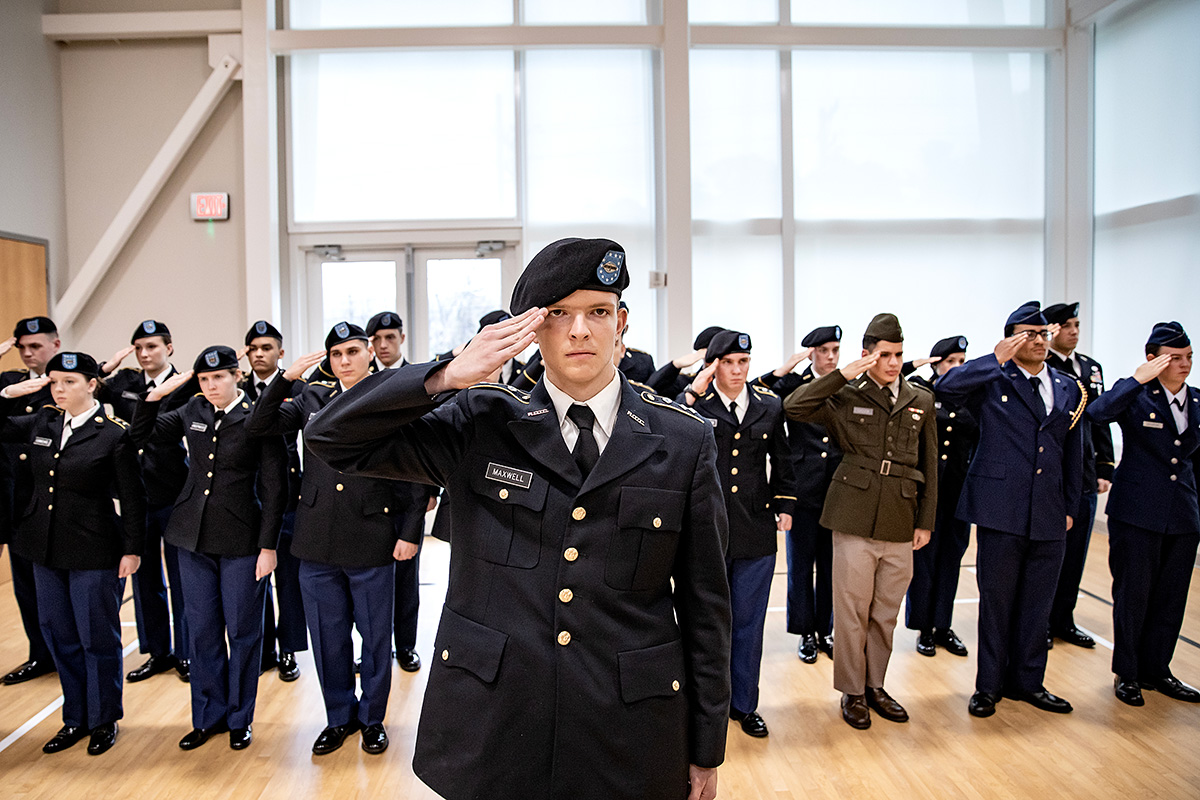 ROTC cadets saluting