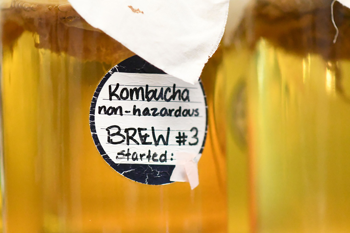 A glass container of kombucha