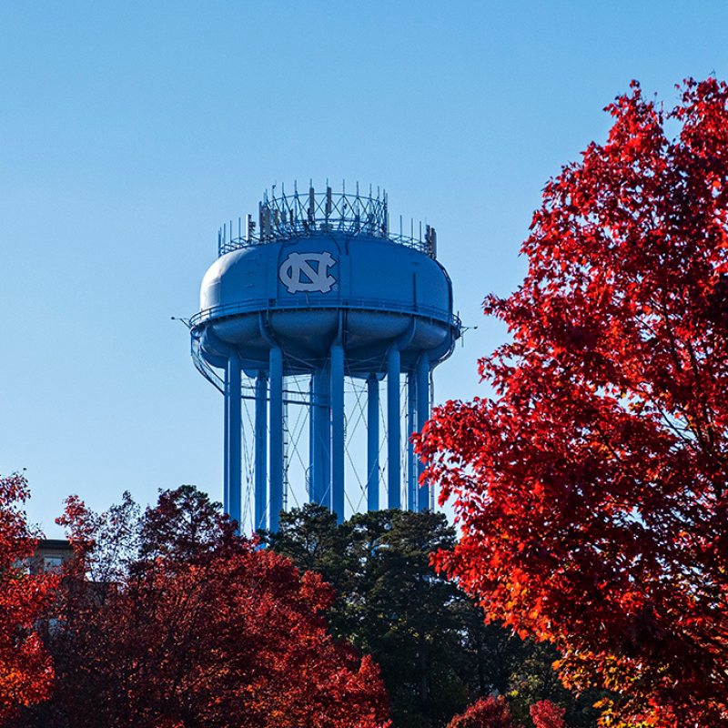A water tower with a UNC logo on it.
