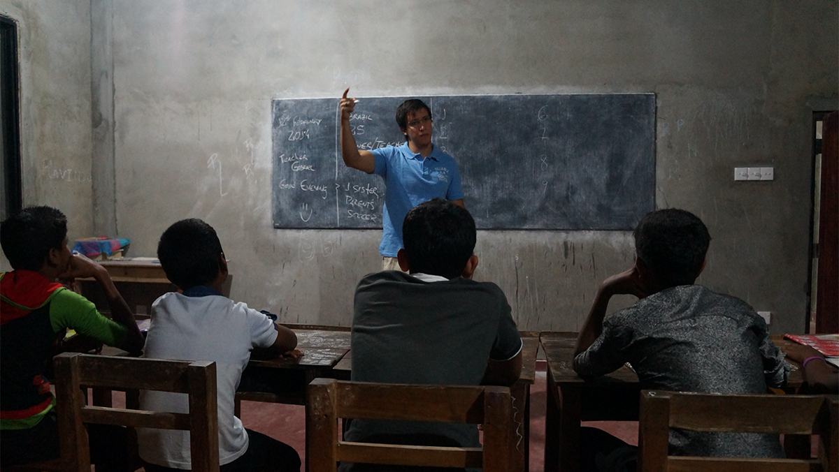 A man teaching a group of students.