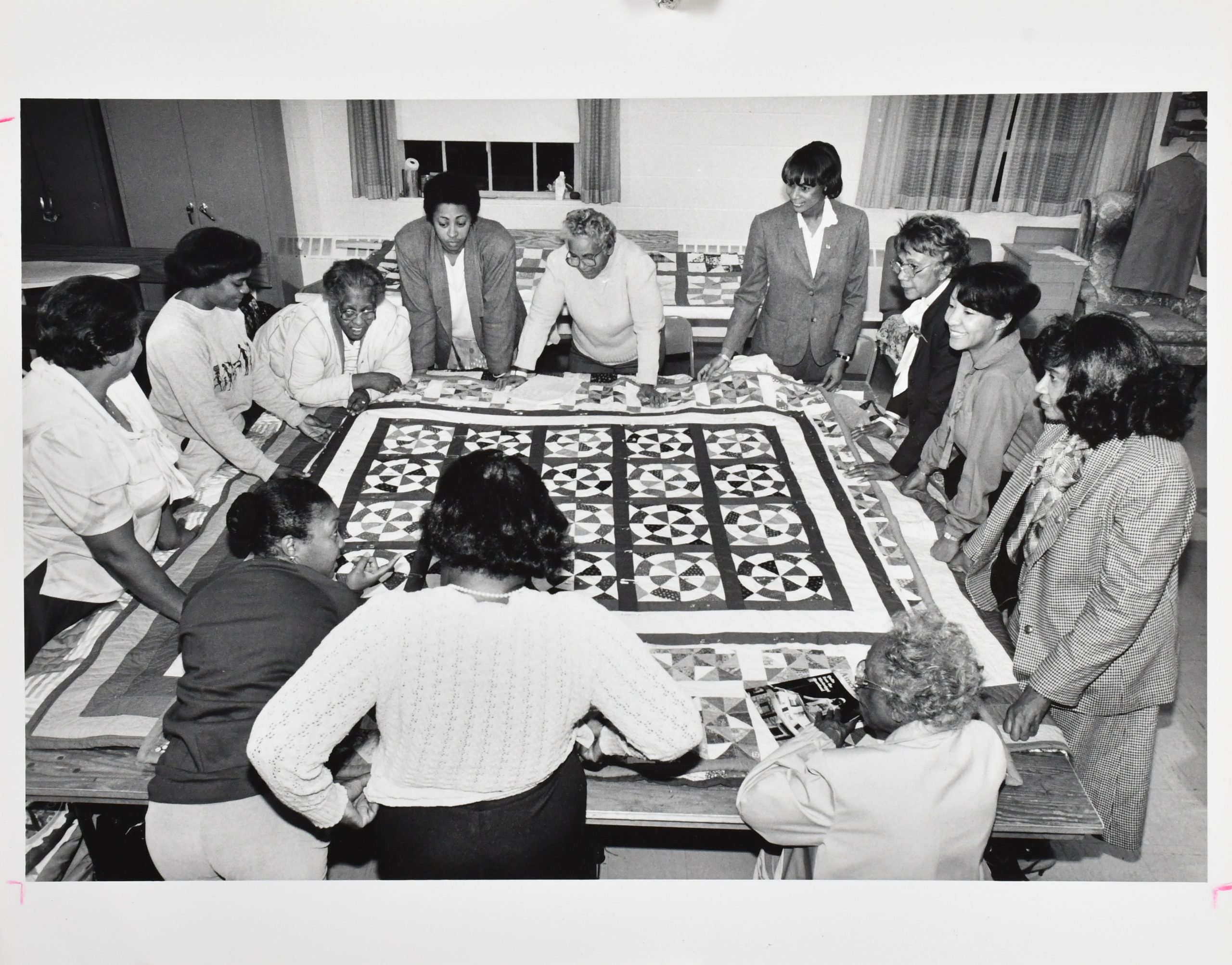 Women working on a quilt.