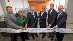 Kevin Guskiewicz, Gladys Robinson, Phil Berger, Jeffrey Warren, John Preyer and David Boliek Jr. participate in cutting the ribbon to open the Collaboratory.