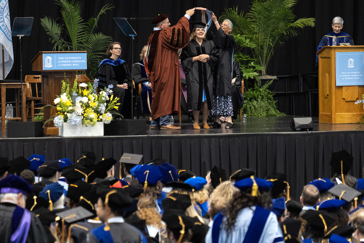 A graduate being hooded.