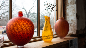 Vases in front of a window.