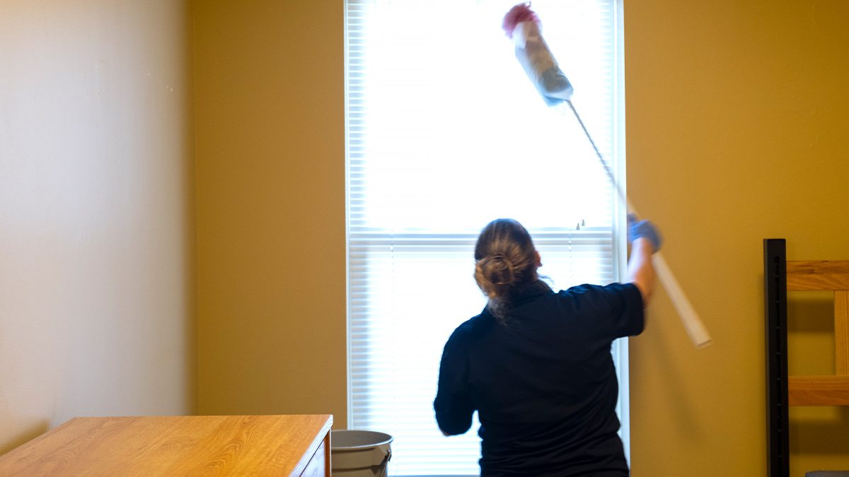 a person dusting