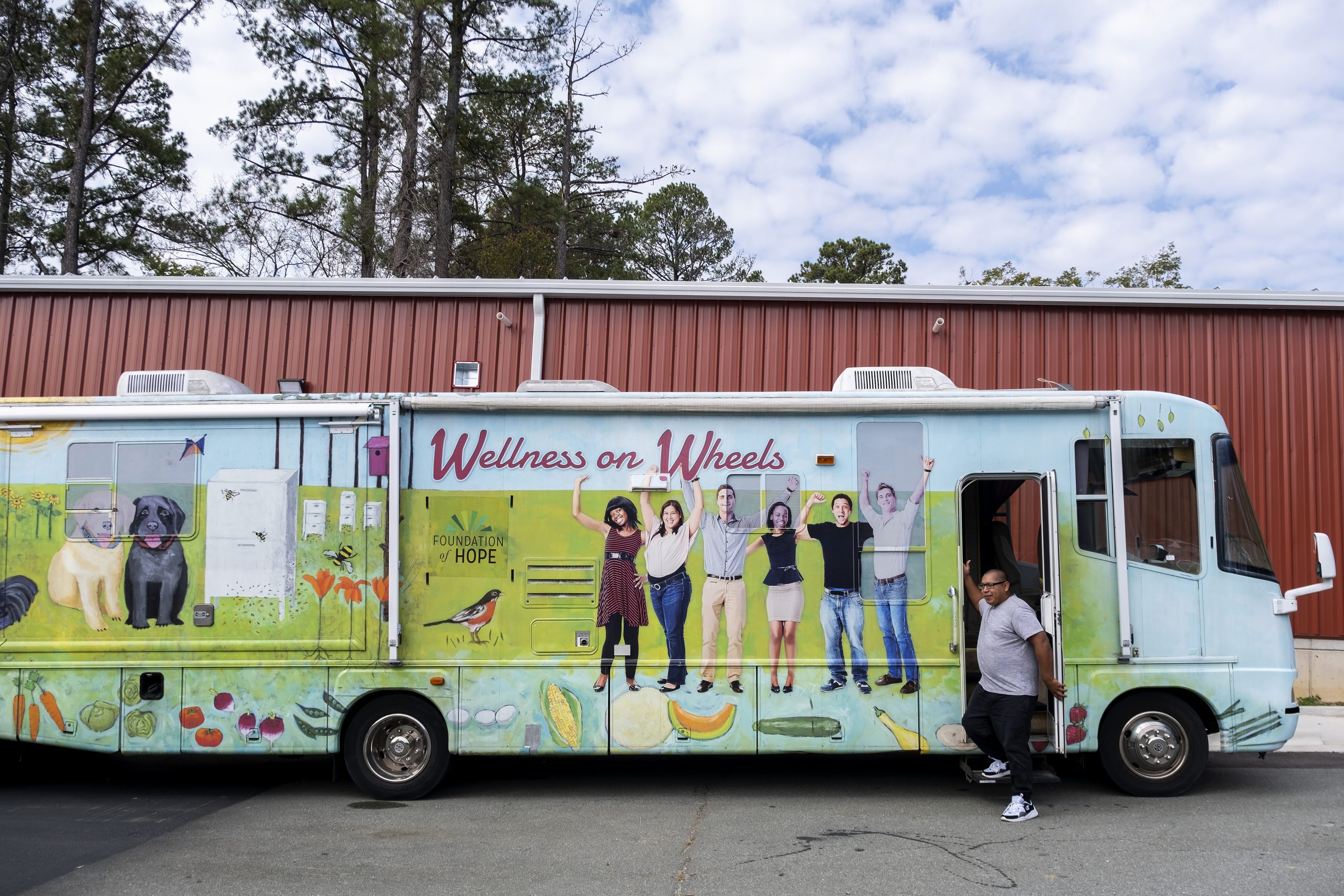 Delfino Benitez steps out of of the Wellness On Wheels RV “Miss Penny.” Benitez, a sophomore majoring in African, African American and diaspora studies, is Miss Penny’s driver and serves as a Spanish language translator at mobile clinics. (Jon Gardiner/UNC-Chapel Hill)